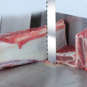 Commercial bone saw blades cutting frozen meat with bone
